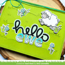 Green pouch with 'hello ewe' text and sheep design on a wooden surface