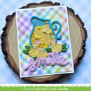 Colorful card with decorative elements on a wooden surface