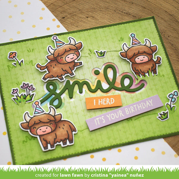 Birthday card with cartoon bulls and text on a green background