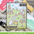 Card with cartoon dog and tomato plants, surrounded by stamping supplies on a wooden surface.