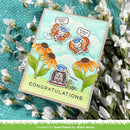 Graduation-themed card with cartoon characters and flowers, surrounded by greenery and flowers.