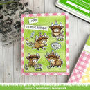 Birthday card with cartoon bulls and stamp set on a wooden surface