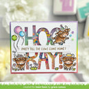 Birthday card with cartoon cows and colorful text on a blurred background