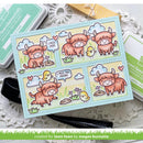 Card with cartoon cows and a chick on a decorative surface, created for lawn fawn by Megan Burnette.