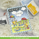 Card with cartoon ducks holding umbrellas and text 'You make me happy. Rain or shine!' on a blurred background.