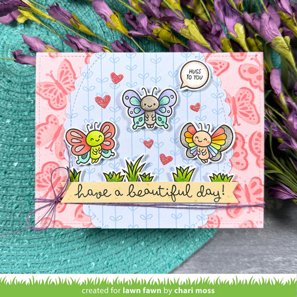 Card with butterfly designs and text 'have a beautiful day!' on a floral background