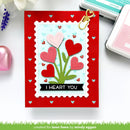 Valentine's Day card with heart design and 'I HEART YOU' text on a red border, surrounded by stamping supplies.