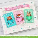 Valentine's Day card with animal-themed paper clips and 'Happy Valentine's Day!' banner.