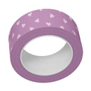Roll of purple tape with white heart patterns on a white background
