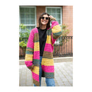 Woman wearing a colorful striped cardigan outdoors.