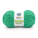 Green skein of yarn with a 'Cover Story' label on a white background