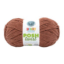 Ball of brown yarn with a 'Cover Story' label on a white background