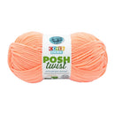 Ball of peach-colored yarn with a 'Cover Story' label on a white background