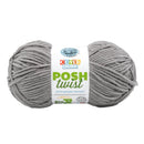 Two balls of gray yarn with a Cover Story Posh Twist label on a white background