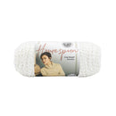 Ball of white yarn with a label featuring a woman wearing a cream sweater on a white background