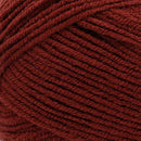 Close-up of a ball of dark red yarn