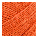 Close-up of bright orange yarn on a white background
