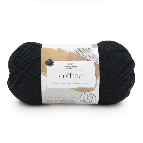 Black yarn skein with a label on a white background