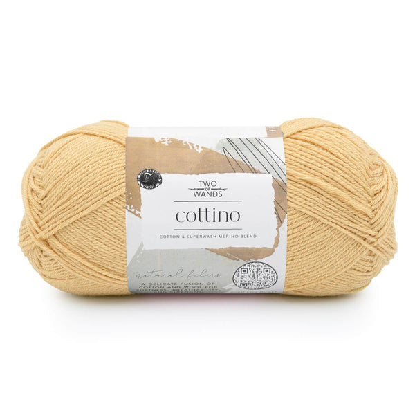 Ball of yellow yarn with a label on a white background