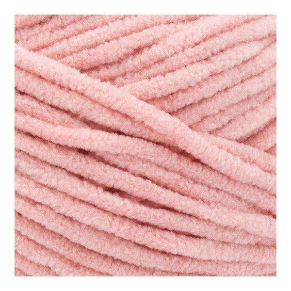 Close-up of pink yarn with a soft texture