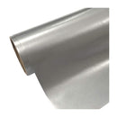 Roll of silver reflective material on a white background