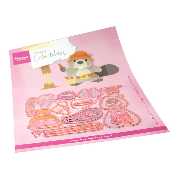 Set of die-cut shapes on a pink card with a cartoon character, brand name visible