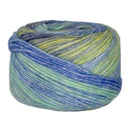 Multicolored yarn ball with blue and green hues on a white background
