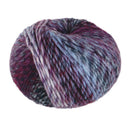 A single ball of variegated yarn with blended purple, blue, gray, and white tones, isolated on a white background.