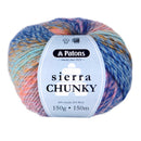 A ball of Patons Sierra Chunky yarn with a light blue paper label, featuring variegated colors of blue, pink, orange, and yellow.