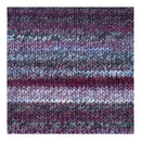 A close-up of a knitted fabric texture with horizontal stripes in variegated shades of purple, burgundy, gray, and white.