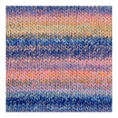 A close-up of a knitted fabric texture with horizontal stripes in blue, purple, pink, peach, and beige tones.