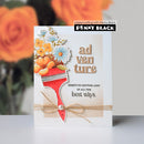 Card with floral design and text, featuring Penny Black branding, against a blurred rose background.