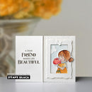 Card with a illustration of a girl holding a flower and text 'A dear friend makes life beautiful' by Penny Black.