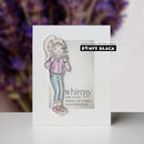 Card with a illustration of a girl and text 'whimsy like yours makes the world a lot brighter' by Penny Black, with a blurred purple flower background.