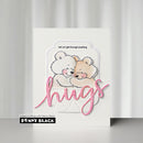 Card with two teddy bears embracing and the word 'hugs' on a white background, featuring Penny Black branding.