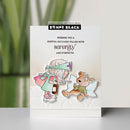 Card with illustrations of a girl and a bear, featuring the brand 'Penny Black'.