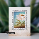 Card with a floral design and 'Penny Black' branding on a blurred green background
