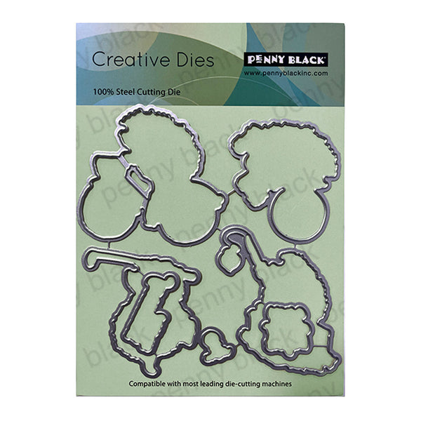 Penny Black Creative Dies with dog and bone shapes on a green cardstock background