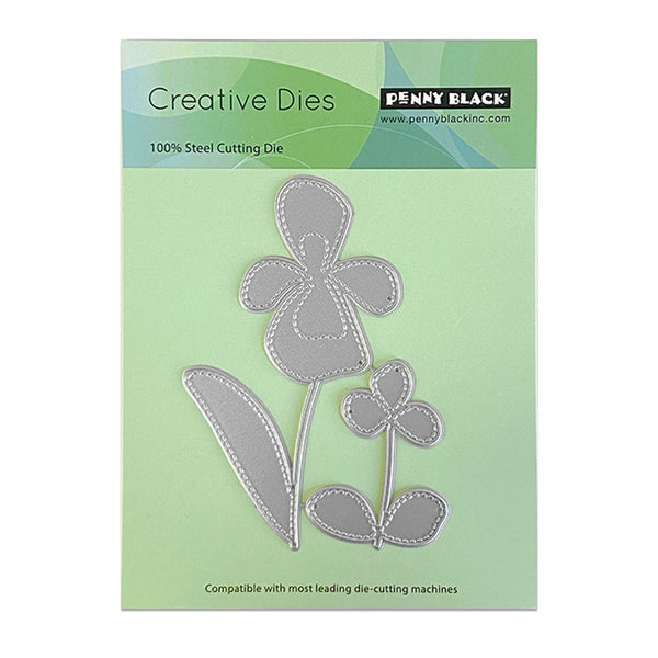 Penny Black Creative Dies with floral design on a green background