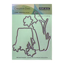 Penny Black Creative Dies for daffodil days cut out on a green background