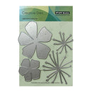 Penny Black Creative Dies with floral shapes on a green and blue background