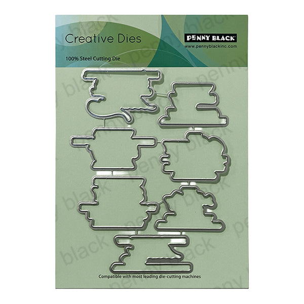Penny Black Creative Dies with metal shapes on a green packaging background