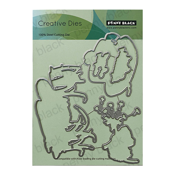 Penny Black Creative Dies with metal cutouts on a green cardstock