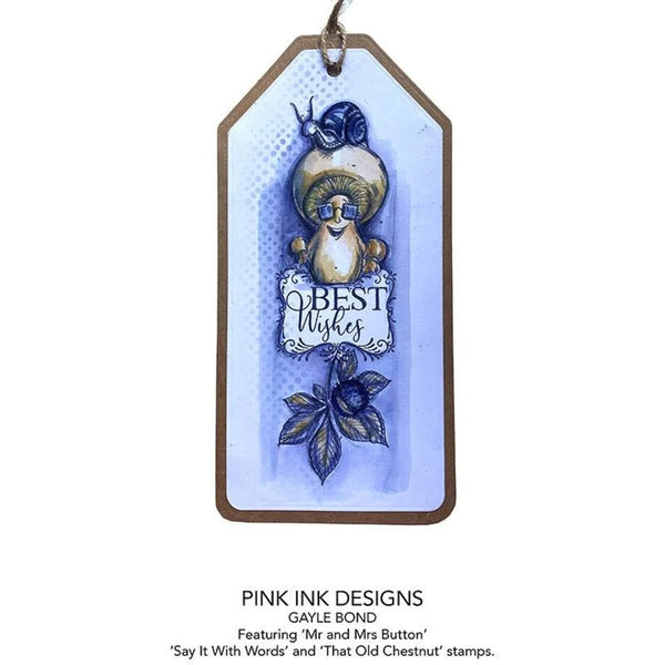 Decorative tag with a cartoon character and 'Best Wishes' text, featuring Pink Ink Designs.