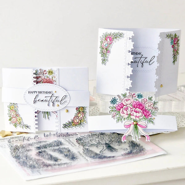 Set of greeting cards with floral designs and 'Happy Birthday, beautiful' text on a white surface.