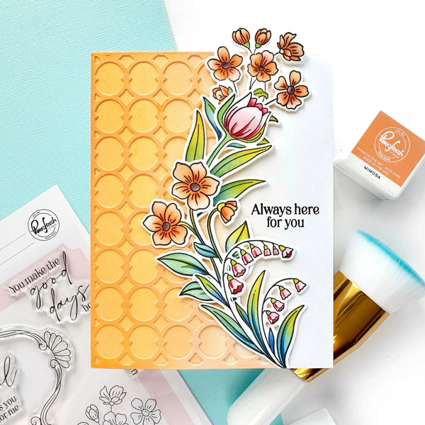 Card with floral design and 'Always here for you' text, surrounded by stamping tools on a light blue background.