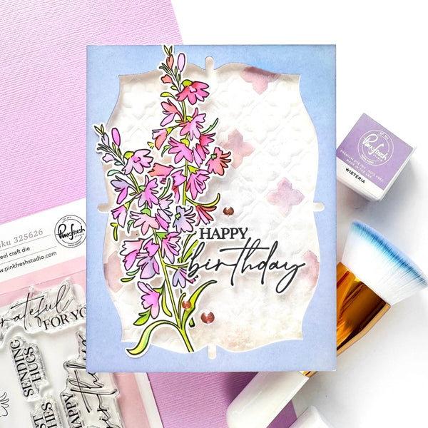 Card with floral design and 'Happy Birthday' text on a pink background