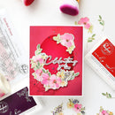 Card with floral design and text 'Celebrating you today' on a white background with stamping tools.