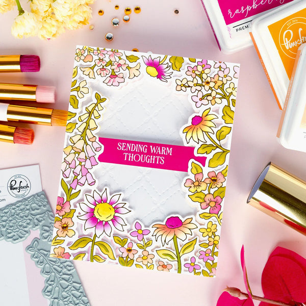 Floral card with 'Sending Warm Thoughts' text surrounded by stationery items on a pink background