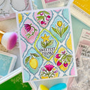 Colorful card with floral design and 'Sweetest Thanks' text, surrounded by crafting supplies.